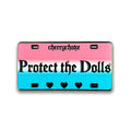 Protect the Dolls hard enamel pin by Cherrychoke, pink and blue license plate-inspired statement pin.